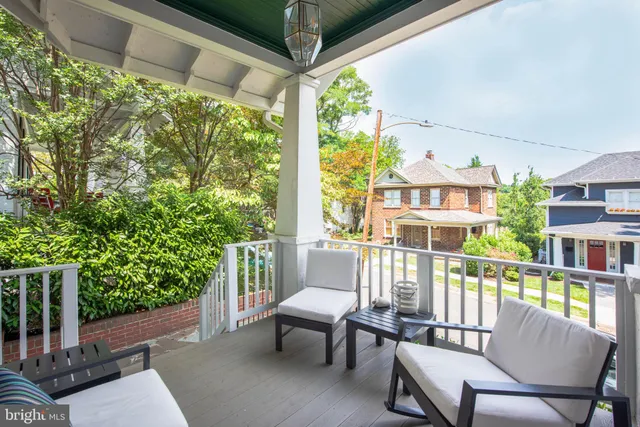a view of a chair and table in the balcony