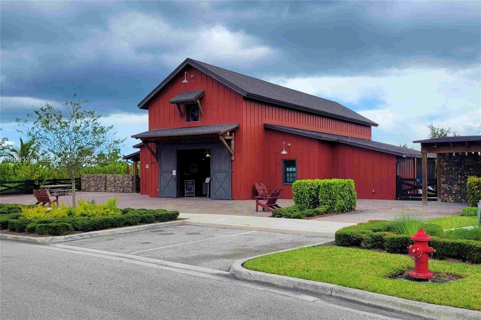 19723 Weathervane Way Loxahatchee, FL 33470 - Photo 12 of 24 a front view of a house with a yard and garage