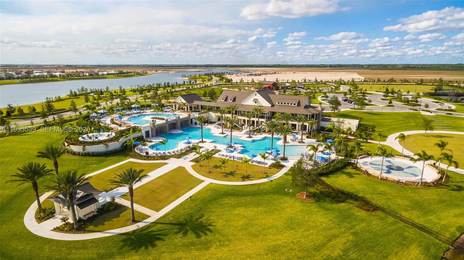 19723 Weathervane Way Loxahatchee, FL 33470 - Photo 9 of 24 a view of a swimming pool with a table and chairs