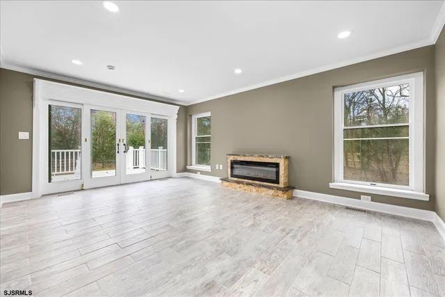 a view of a house with swimming pool and sitting area