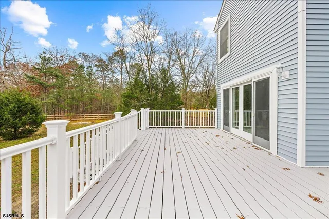 a room with a window and wooden floor