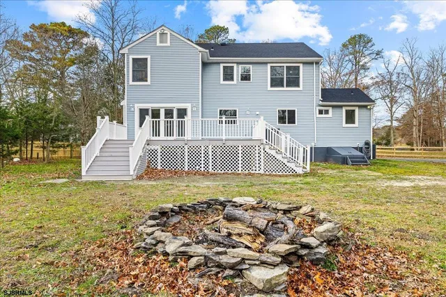 a view of a hallway with wooden floor and windows