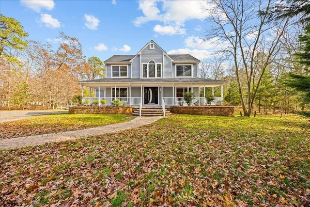 a view of a swimming pool with a house in the background