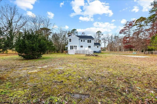 an empty room with closet and wooden floor