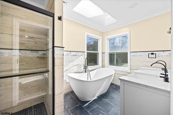 a kitchen with stainless steel appliances granite countertop a refrigerator stove and microwave