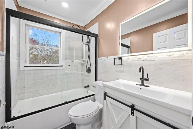 a white tub sitting next to a window