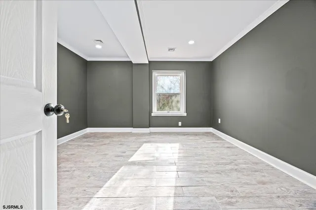 a view of an empty room with a fireplace