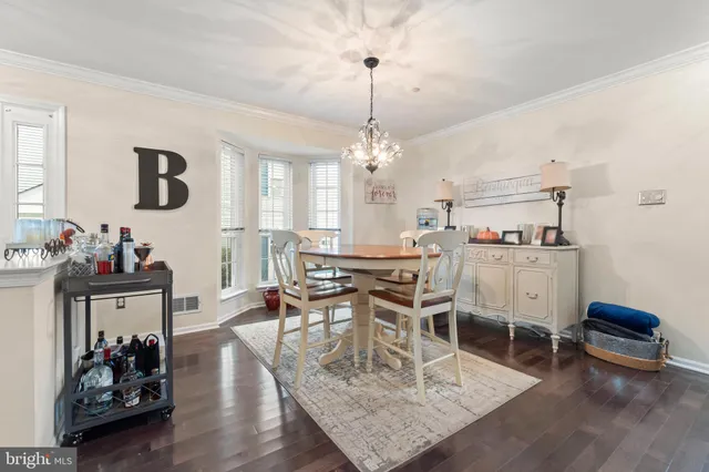 a living room with furniture a window and gym equipment