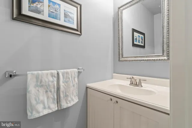 a bathroom with a sink and mirror