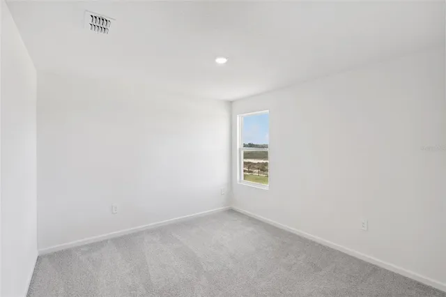 a view of a livingroom and window