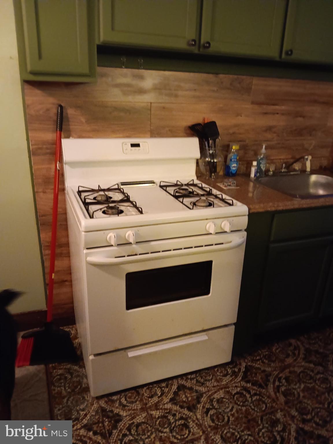 517 Wiltshire Road Upper Darby, PA 19082 - Photo 5 of 10 a stove top oven sitting inside of a kitchen