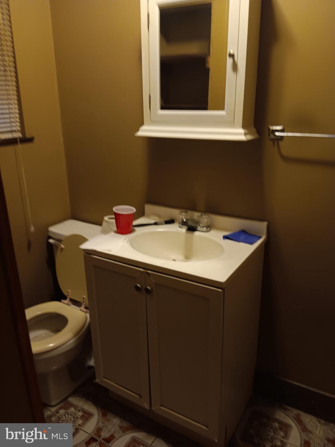 517 Wiltshire Road Upper Darby, PA 19082 - Photo 8 of 10 a bathroom with a sink and a toilet