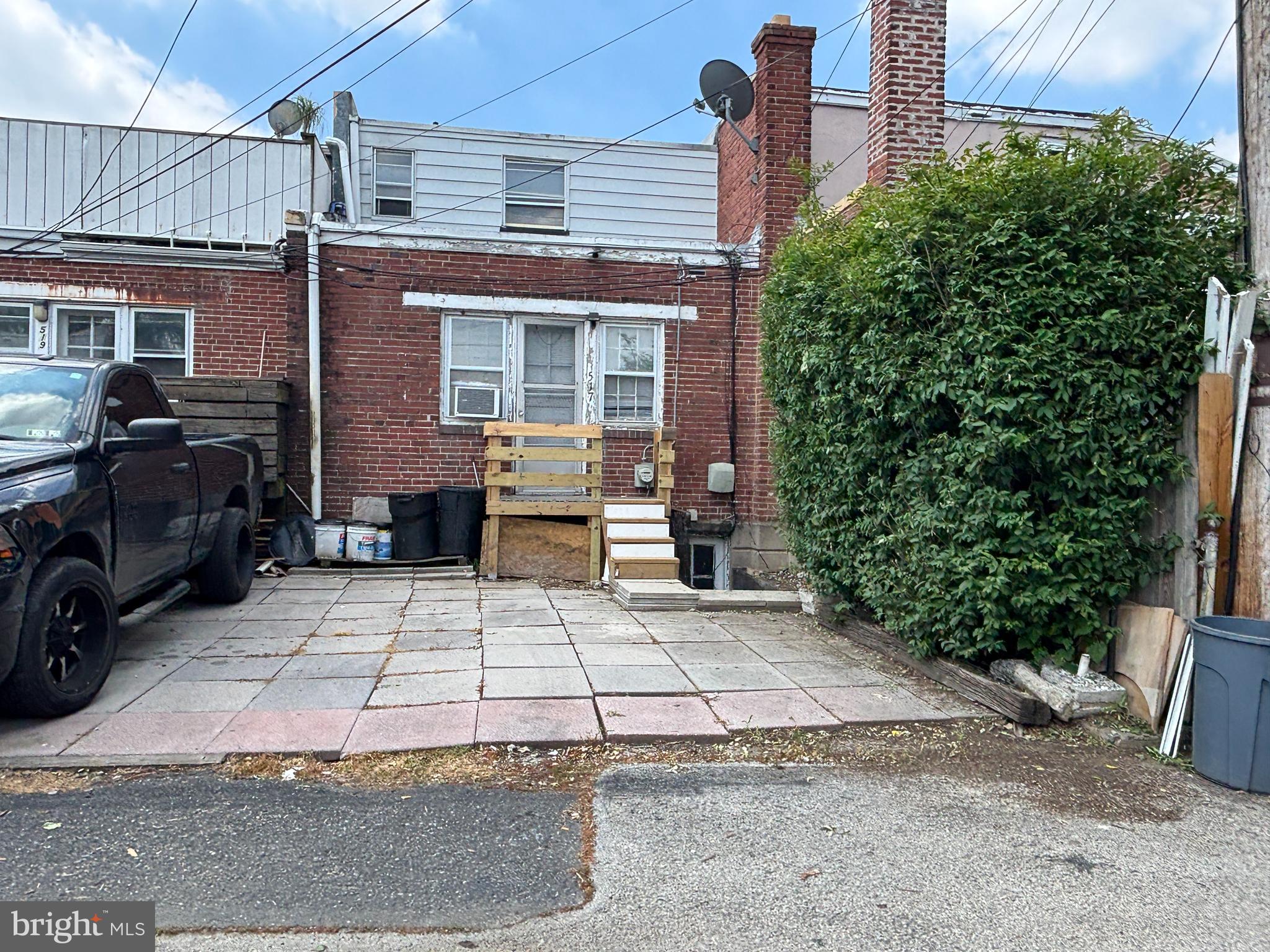 517 Wiltshire Road Upper Darby, PA 19082 - Photo 10 of 10 front view of a house with a bench in front of it
