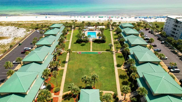 an aerial view of a residential houses with outdoor space