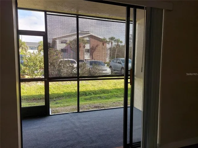 a view of a room with a large window