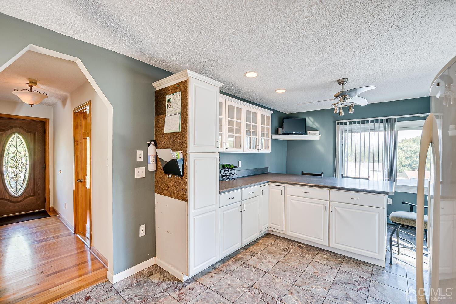 3 Normandy Road Colonia, NJ 07067 - Photo 12 of 40 a kitchen with a refrigerator and a sink
