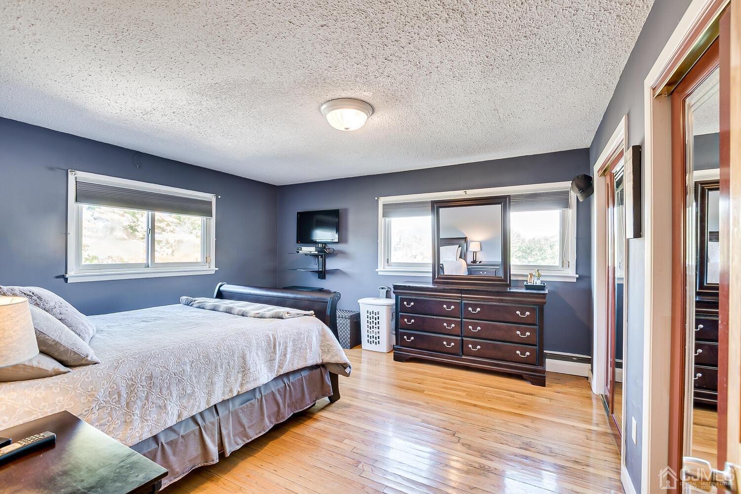 3 Normandy Road Colonia, NJ 07067 - Photo 14 of 40 a bedroom with a bed and a large window