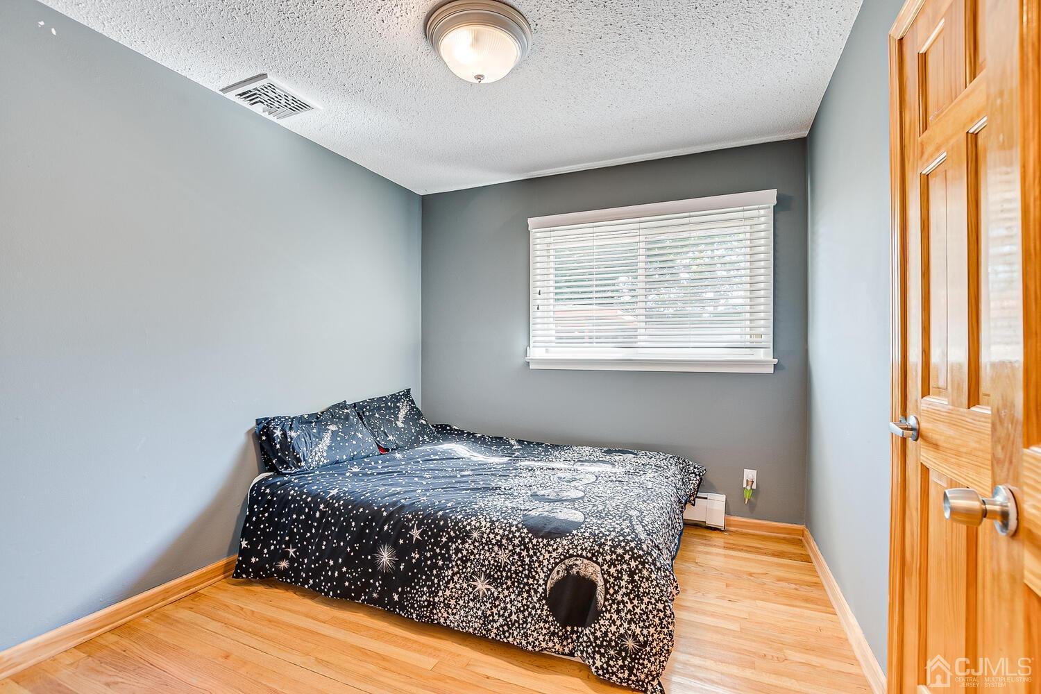 3 Normandy Road Colonia, NJ 07067 - Photo 15 of 40 a bedroom with a bed and a window