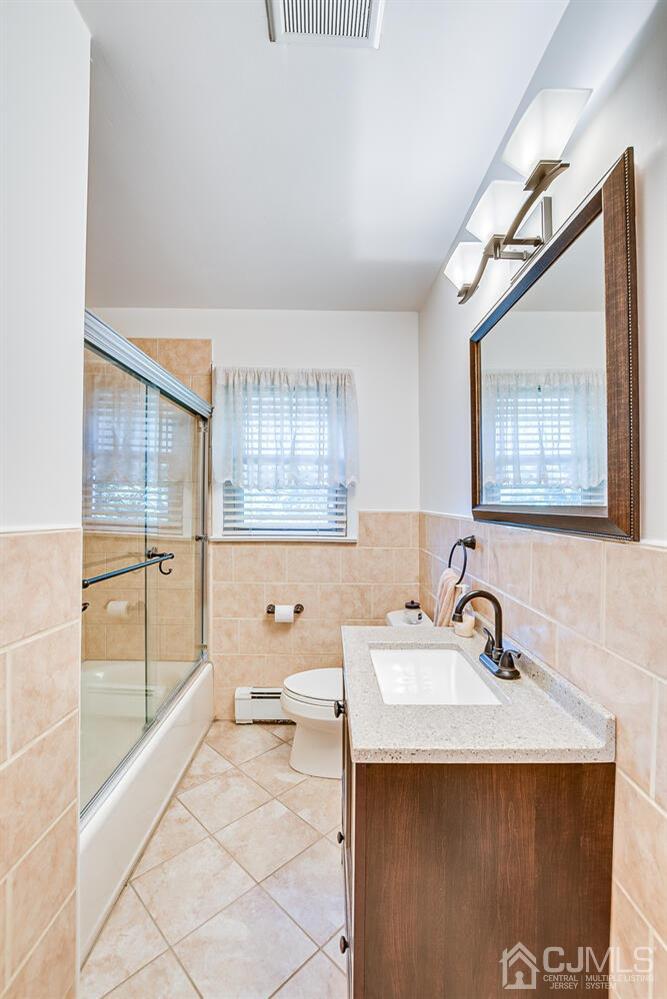 3 Normandy Road Colonia, NJ 07067 - Photo 16 of 40 a bathroom with a sink and a mirror