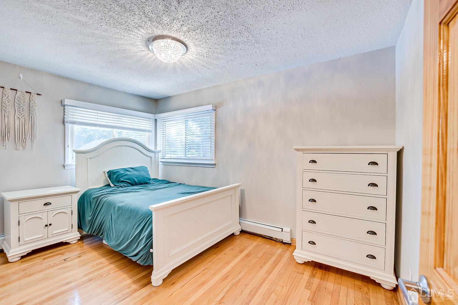 3 Normandy Road Colonia, NJ 07067 - Photo 17 of 40 a bedroom with a bed and a closet