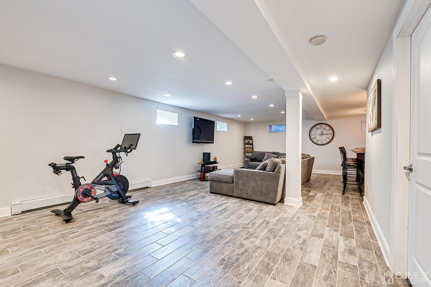 3 Normandy Road Colonia, NJ 07067 - Photo 19 of 40 a living room with furniture and wooden floor