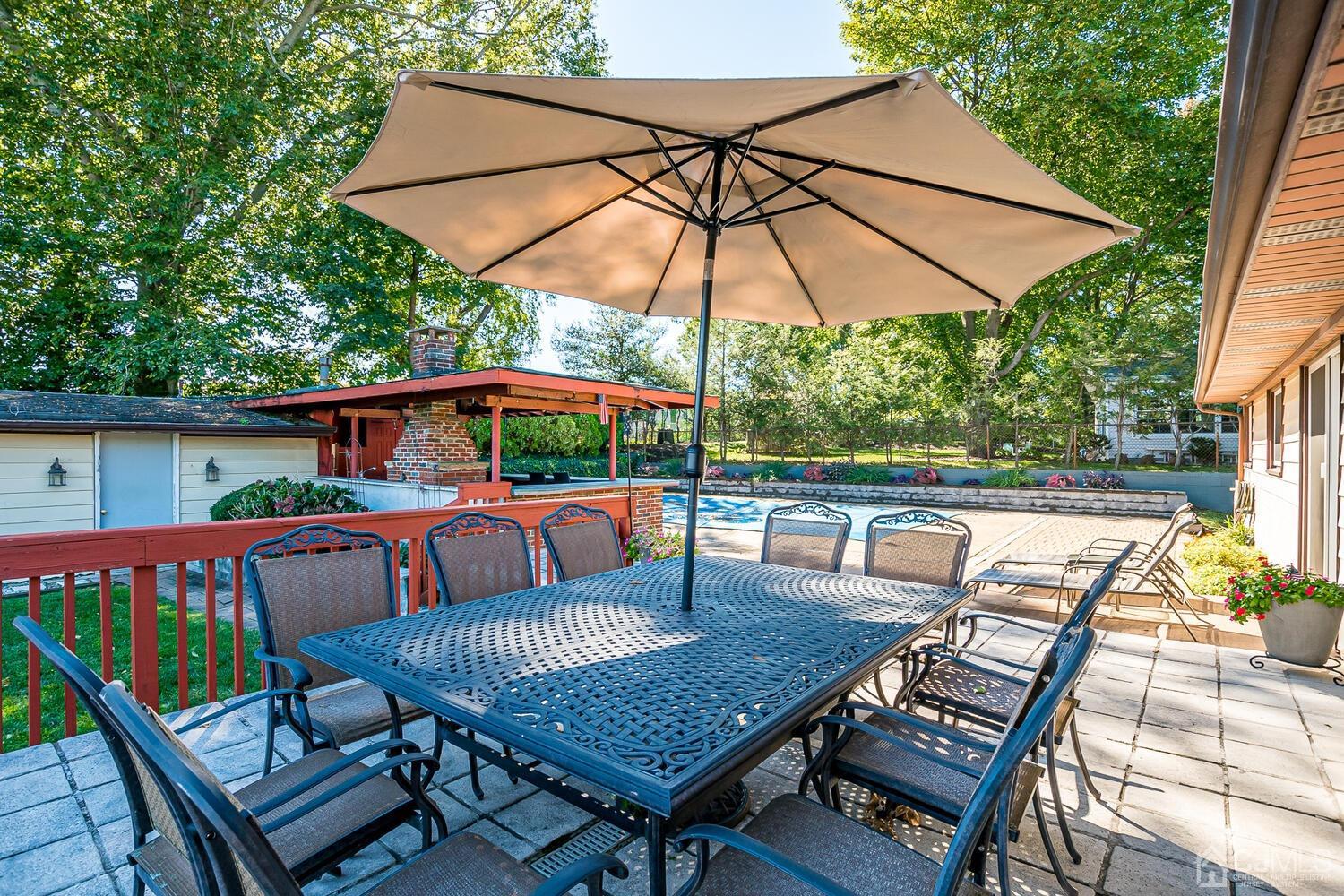 3 Normandy Road Colonia, NJ 07067 - Photo 29 of 40 a view of deck with furniture and umbrella