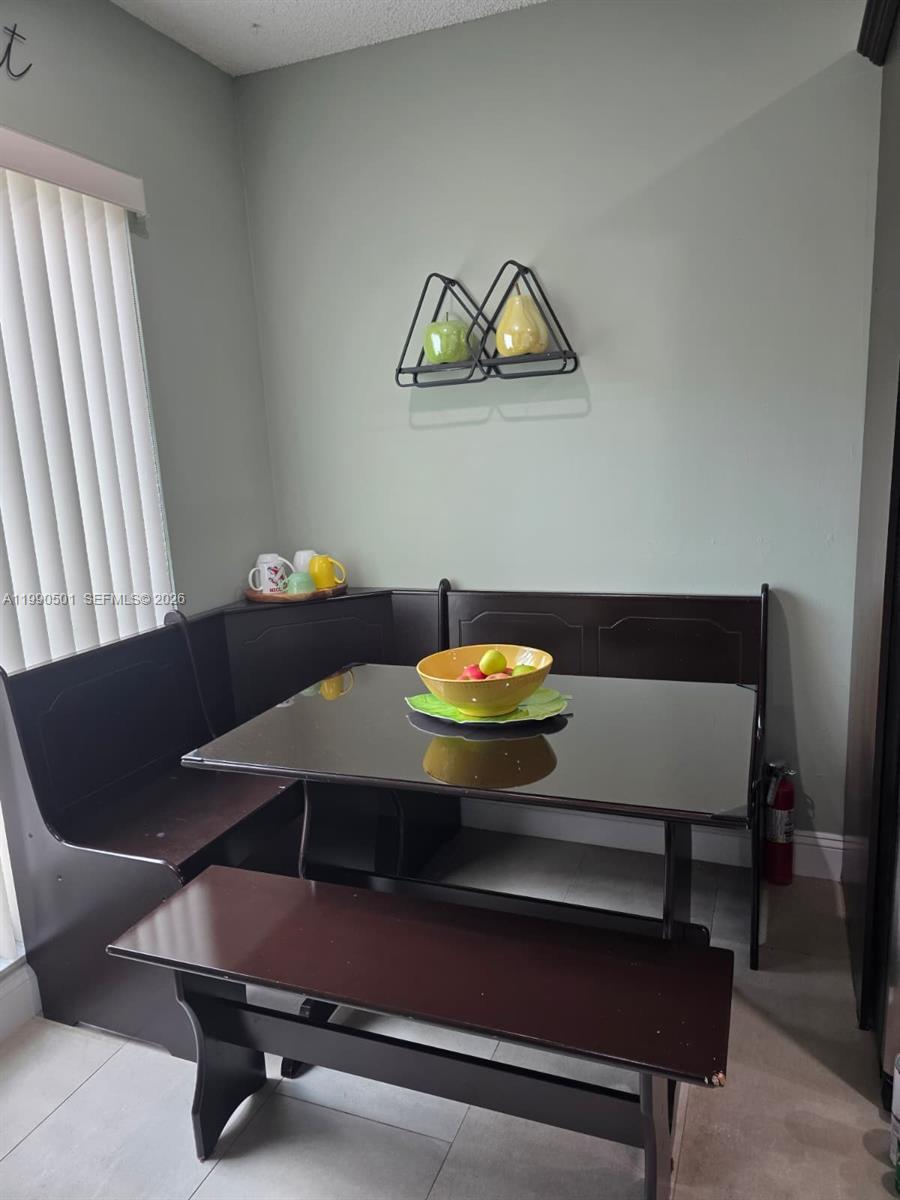 893 Southwest 120th Way Davie, FL 33325 - Photo 7 of 22 a living room with a couch
