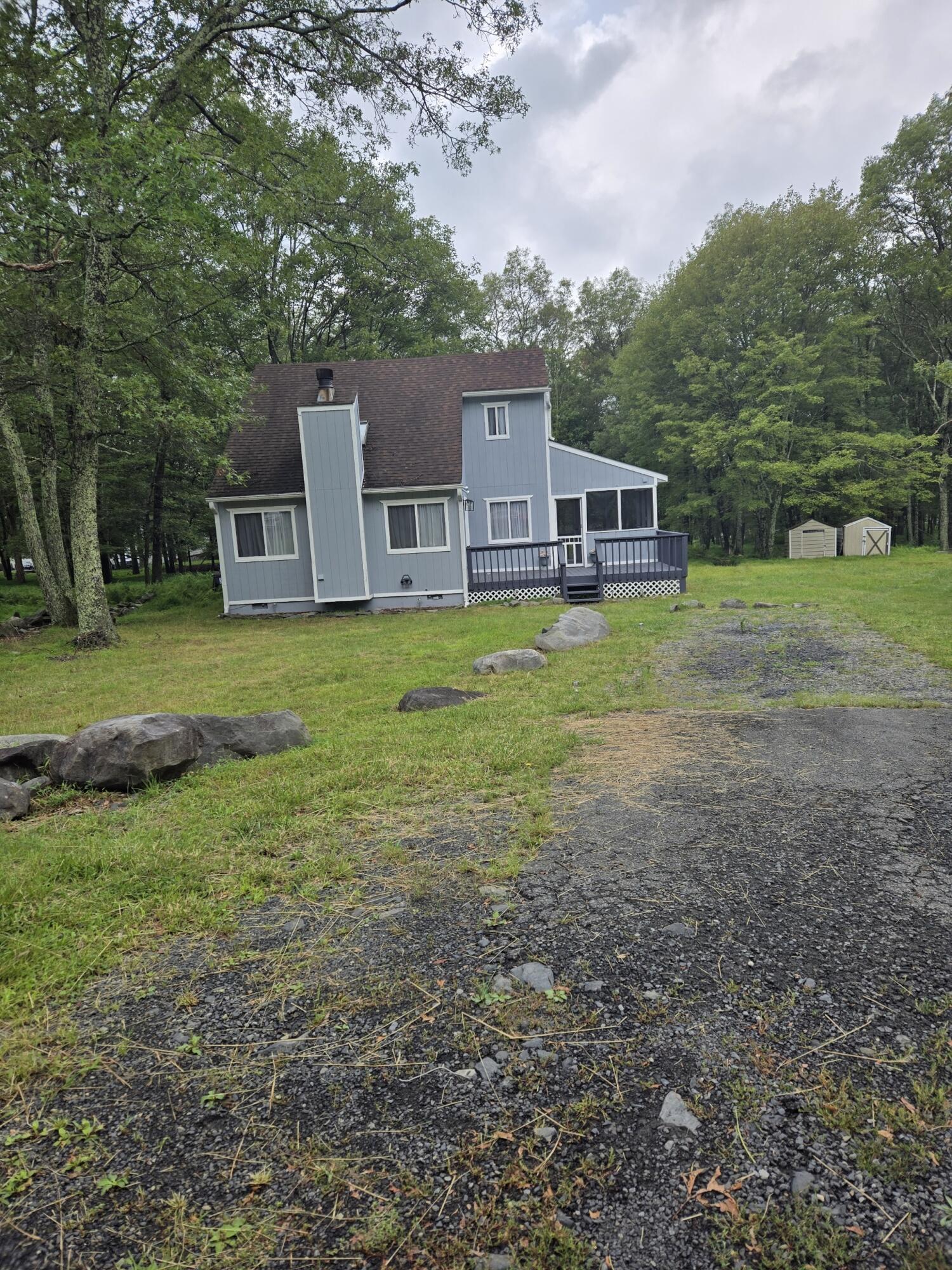 136 Huffman Circle Bushkill, PA 18324 - Photo 2 of 11 a house view with a garden space