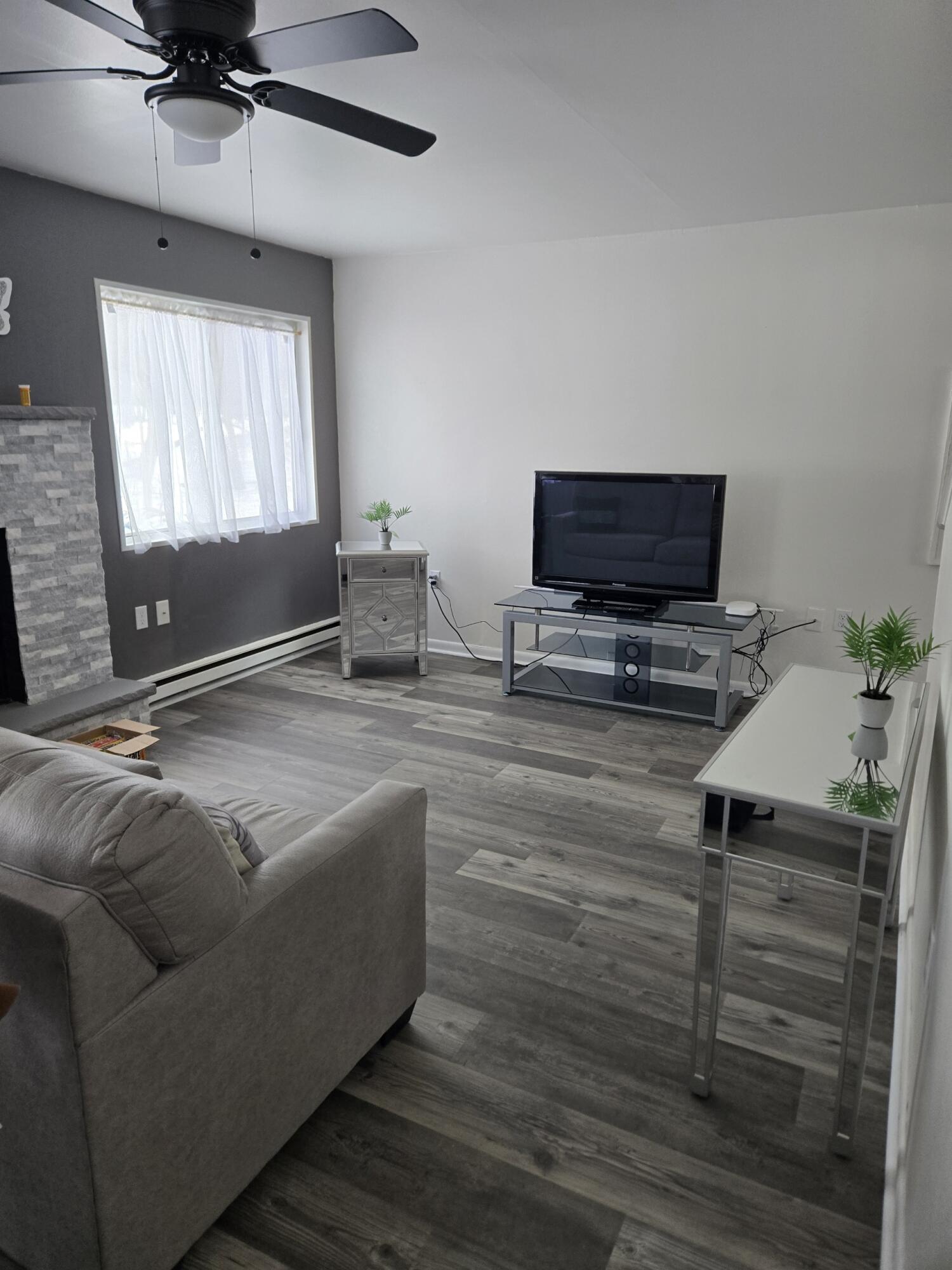 136 Huffman Circle Bushkill, PA 18324 - Photo 3 of 11 a living room with furniture and a flat screen tv