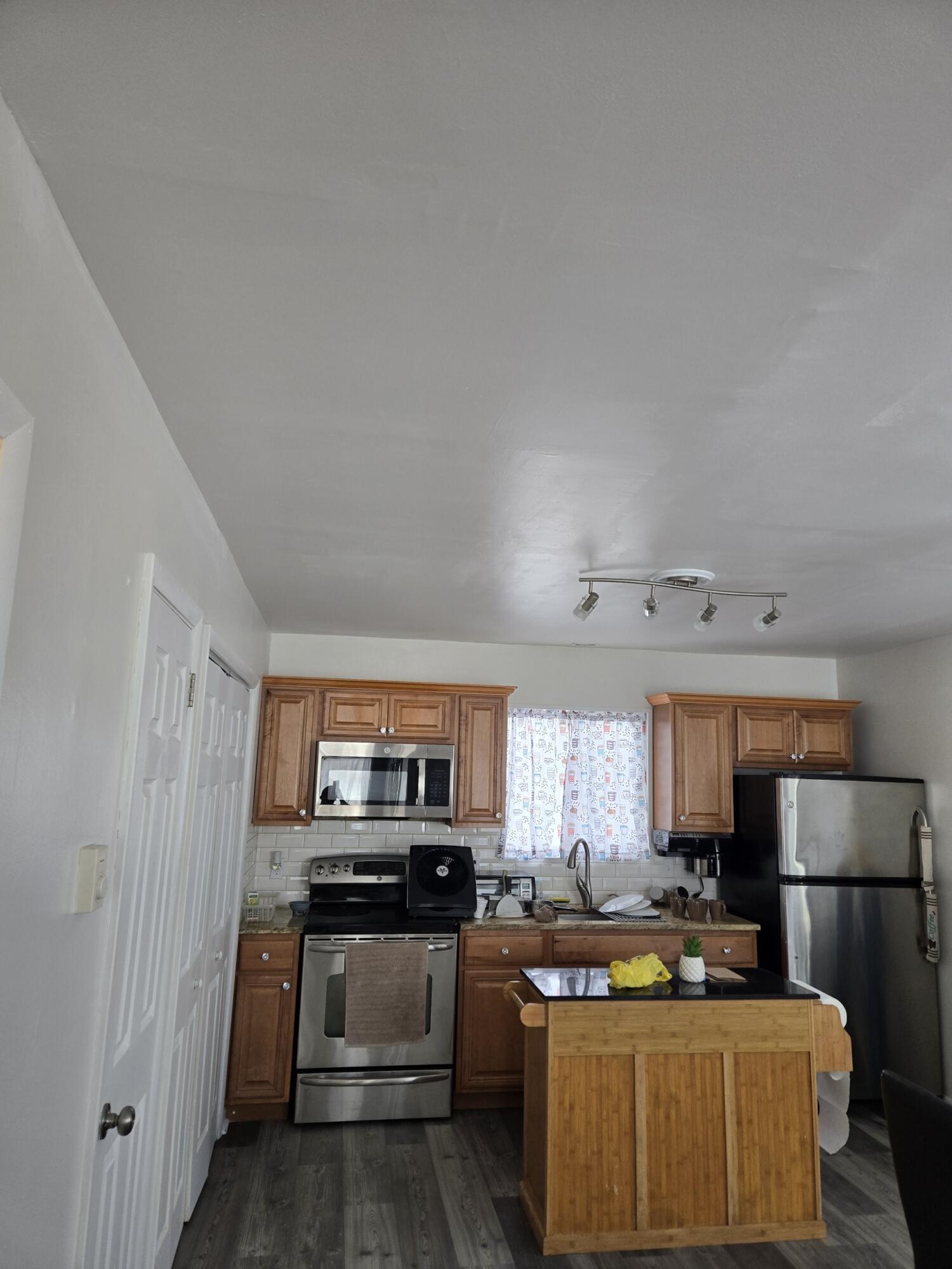 136 Huffman Circle Bushkill, PA 18324 - Photo 5 of 11 a kitchen with kitchen island a stove a sink a refrigerator and cabinets