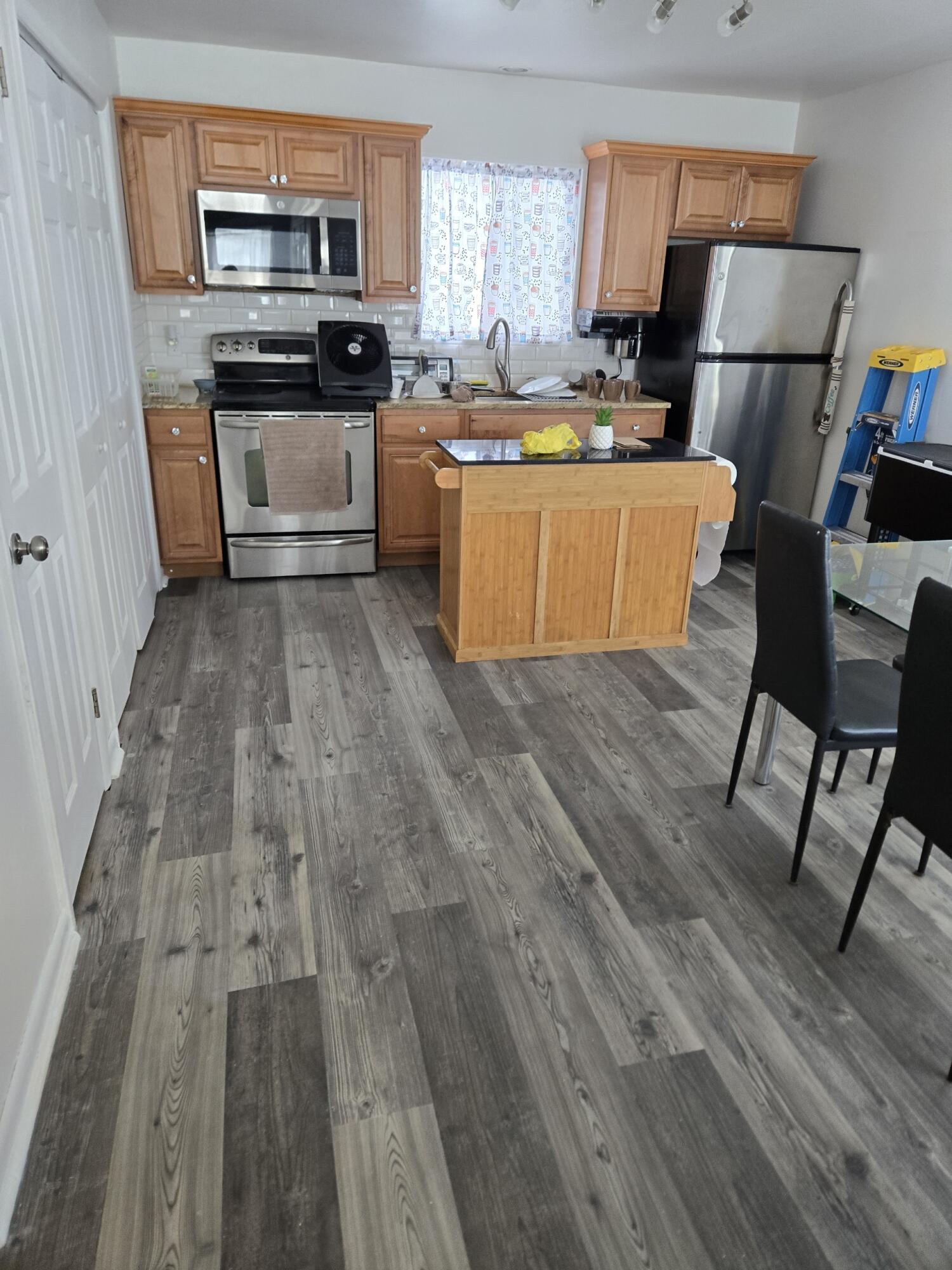 136 Huffman Circle Bushkill, PA 18324 - Photo 6 of 11 a kitchen with stainless steel appliances granite countertop a refrigerator a stove top oven a sink and dishwasher