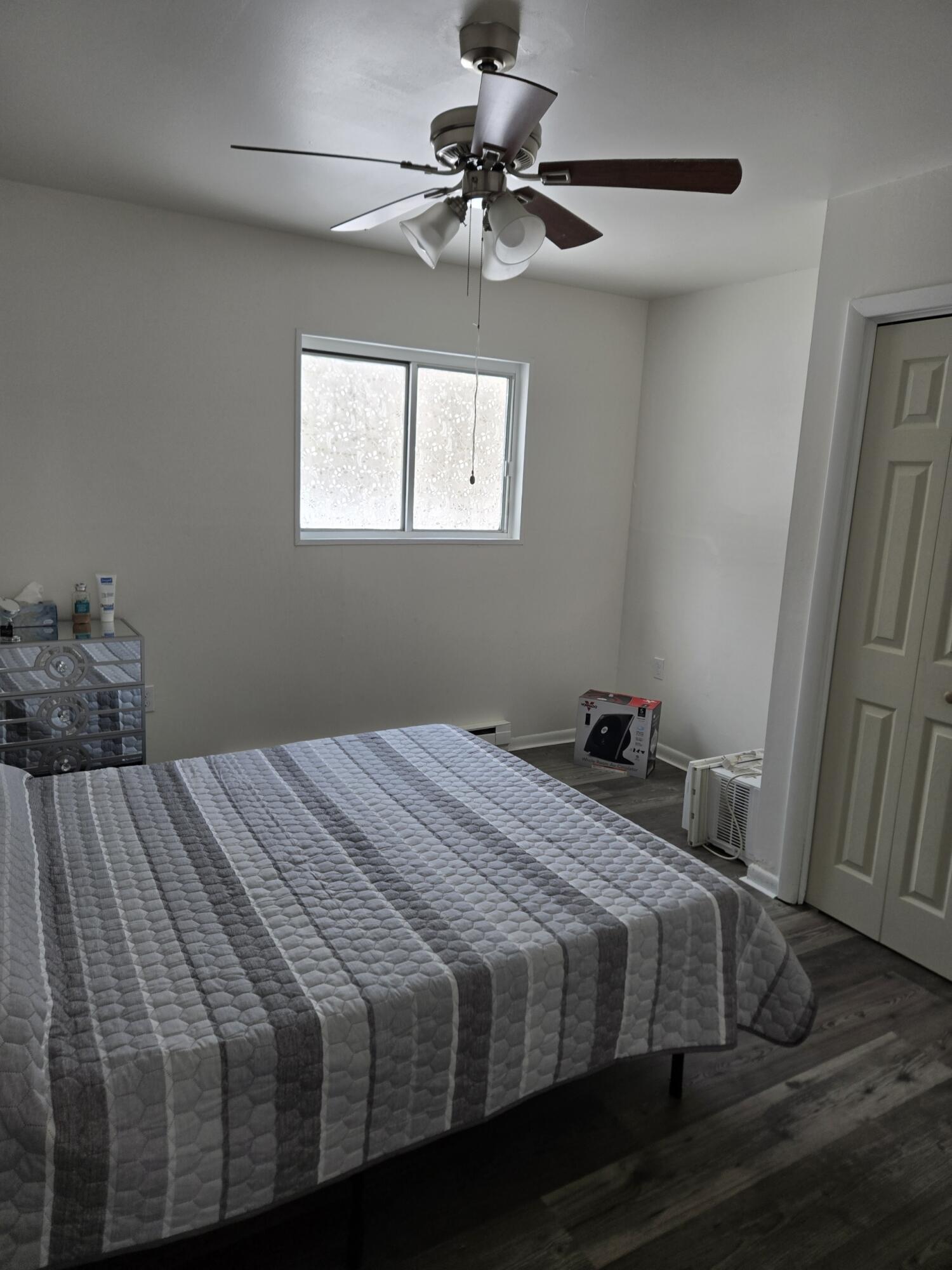 136 Huffman Circle Bushkill, PA 18324 - Photo 7 of 11 a bedroom with a bed and a chandelier