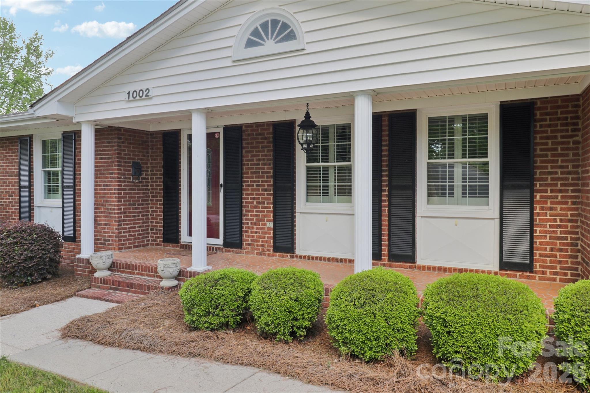 1002 Ridge Street Albemarle, NC 28001 - Photo 3 of 45 a front view of a house with garden