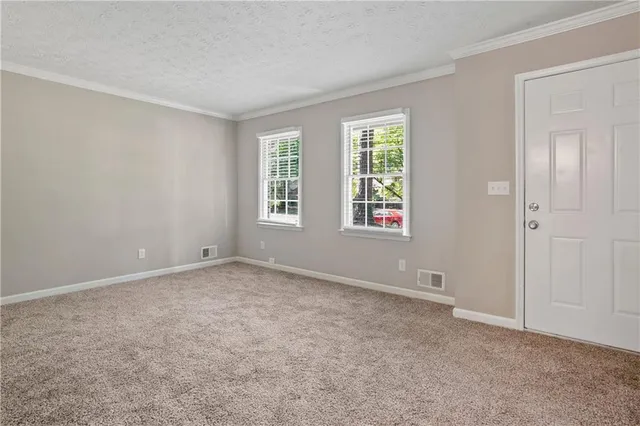 an empty room with windows