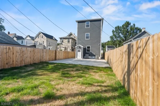 a view of swimming pool with a backyard