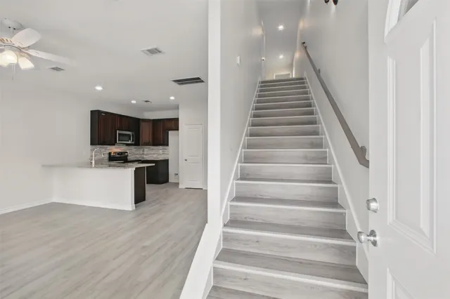a view of kitchen with sink microwave and stove