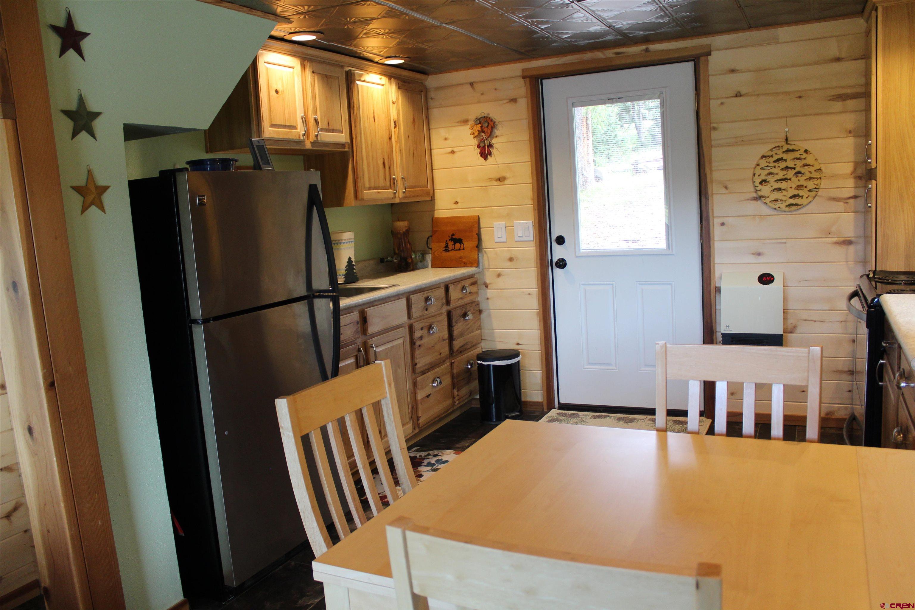 21629 Baron Lake Drive Cedaredge, CO 81413 - Photo 12 of 34 a view of kitchen and utility room