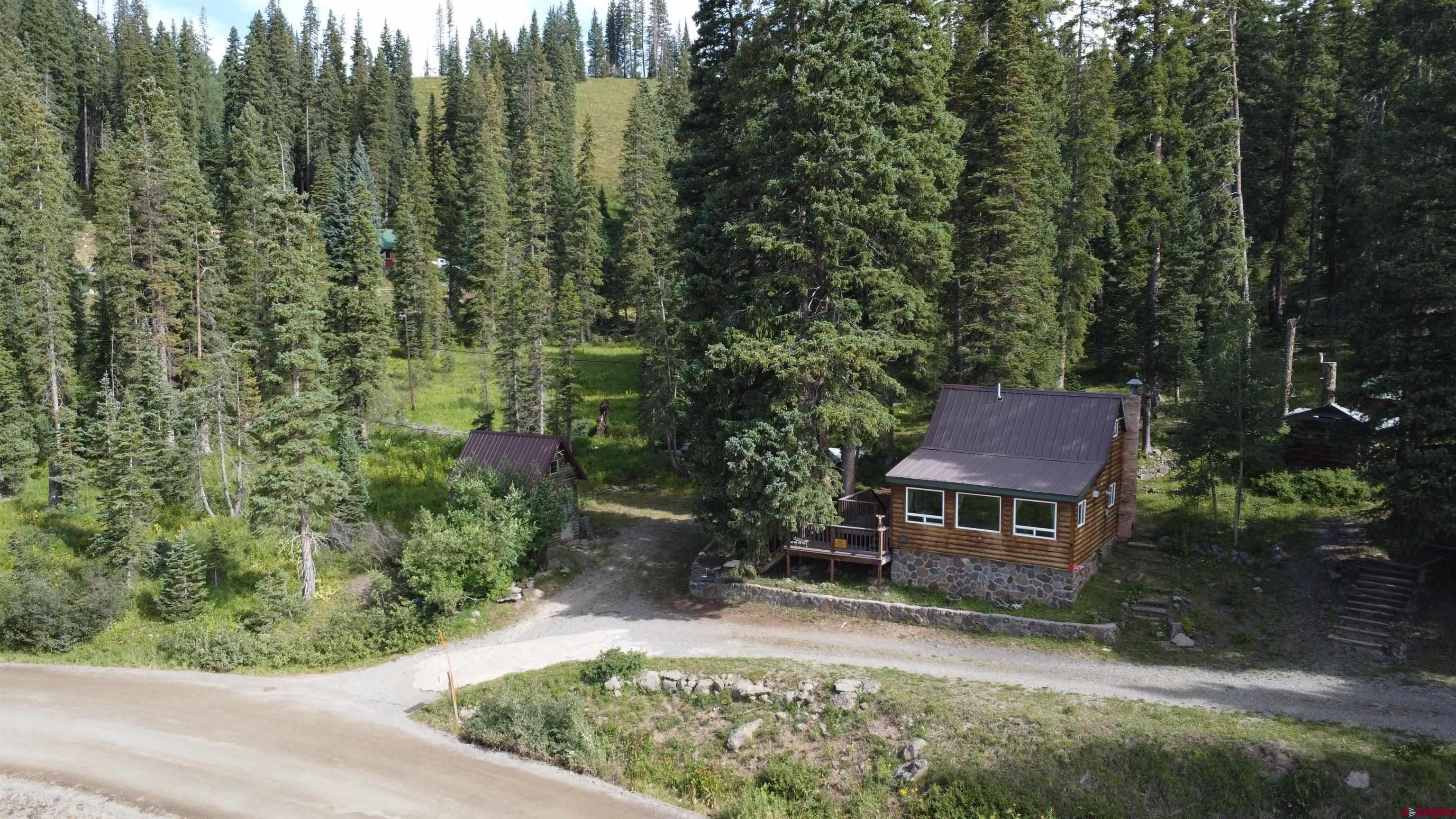 21629 Baron Lake Drive Cedaredge, CO 81413 - Photo 2 of 34 an aerial view of a house with a yard