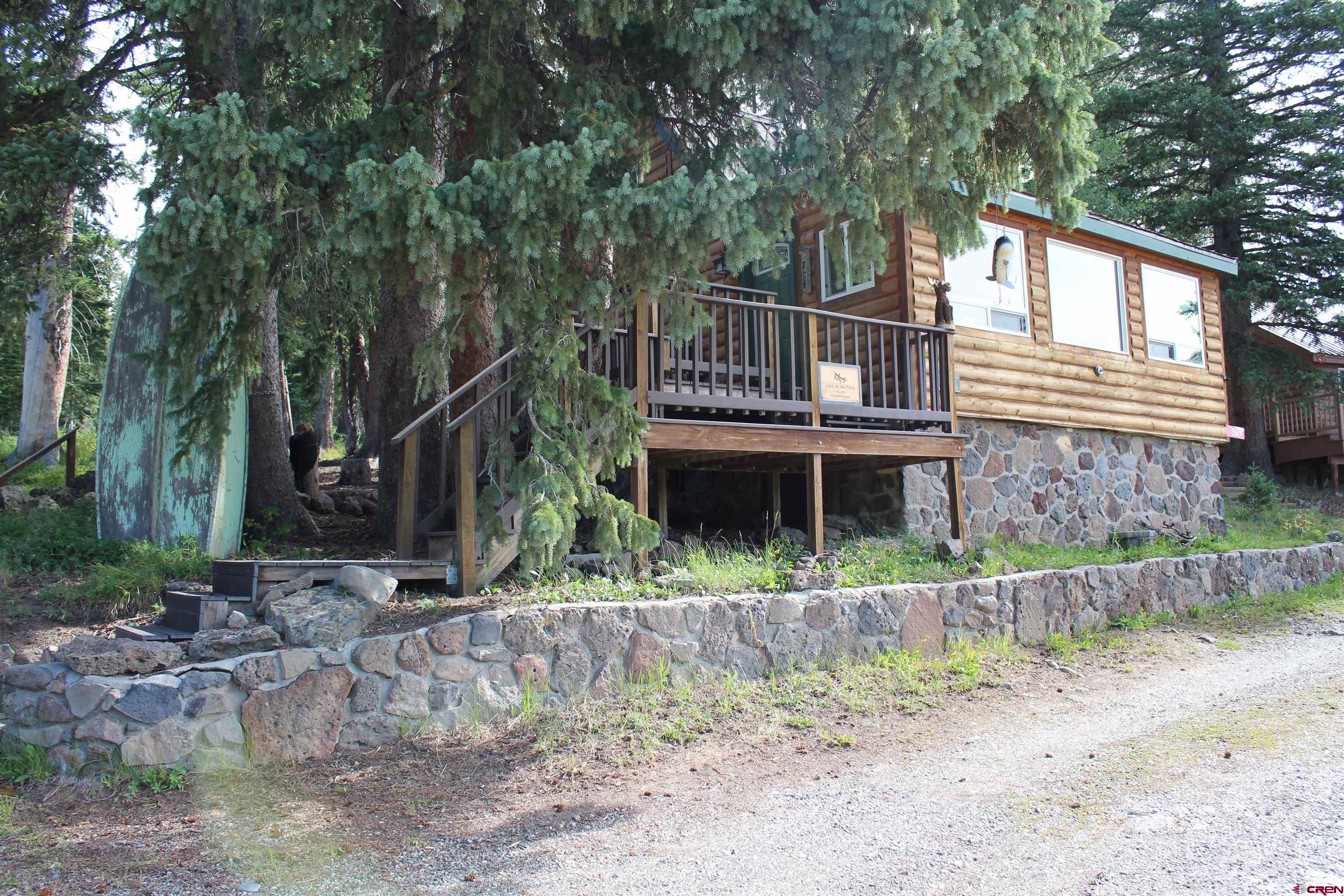 21629 Baron Lake Drive Cedaredge, CO 81413 - Photo 21 of 34 a front view of a house with a yard