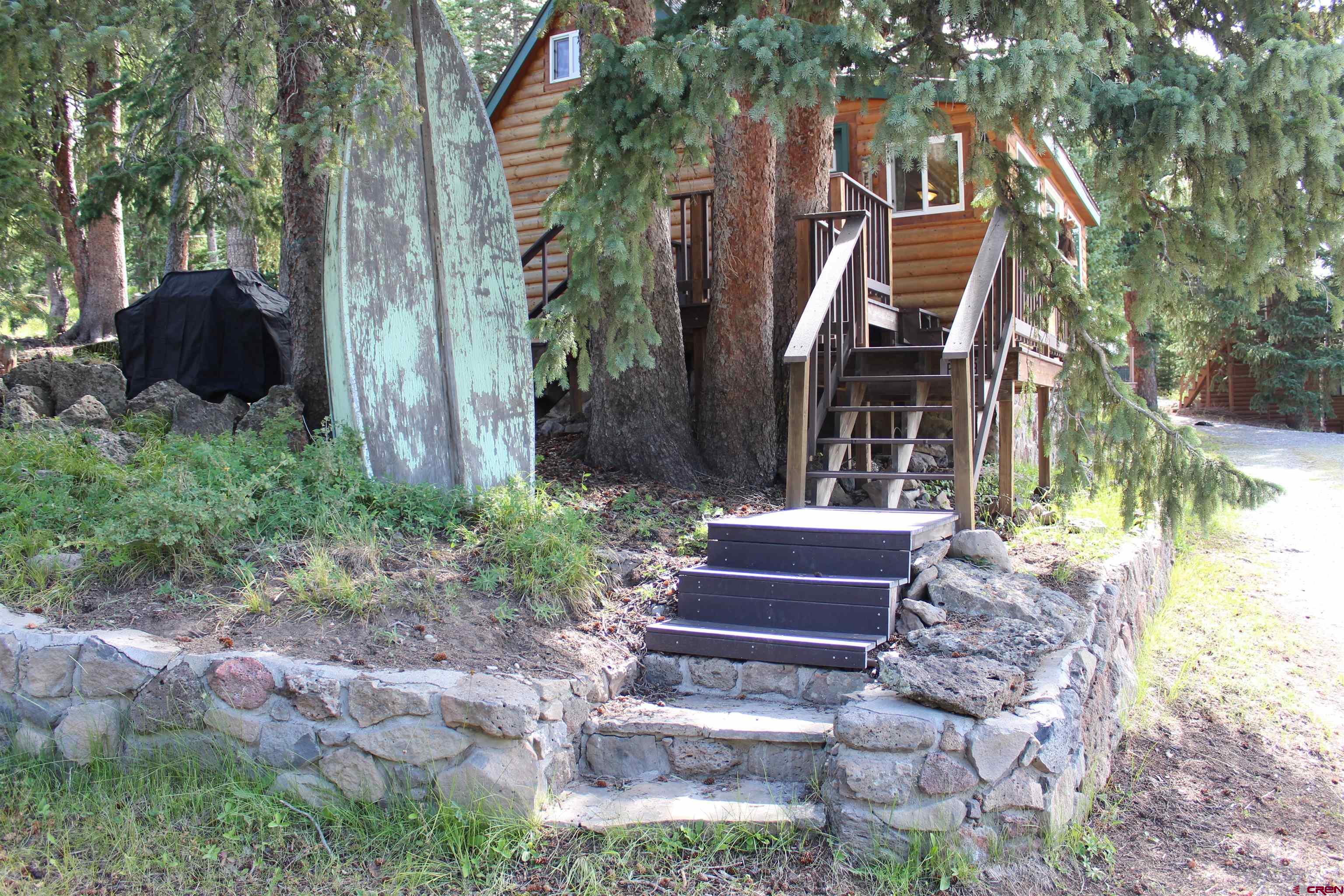 21629 Baron Lake Drive Cedaredge, CO 81413 - Photo 24 of 34 a front view of a house with a yard