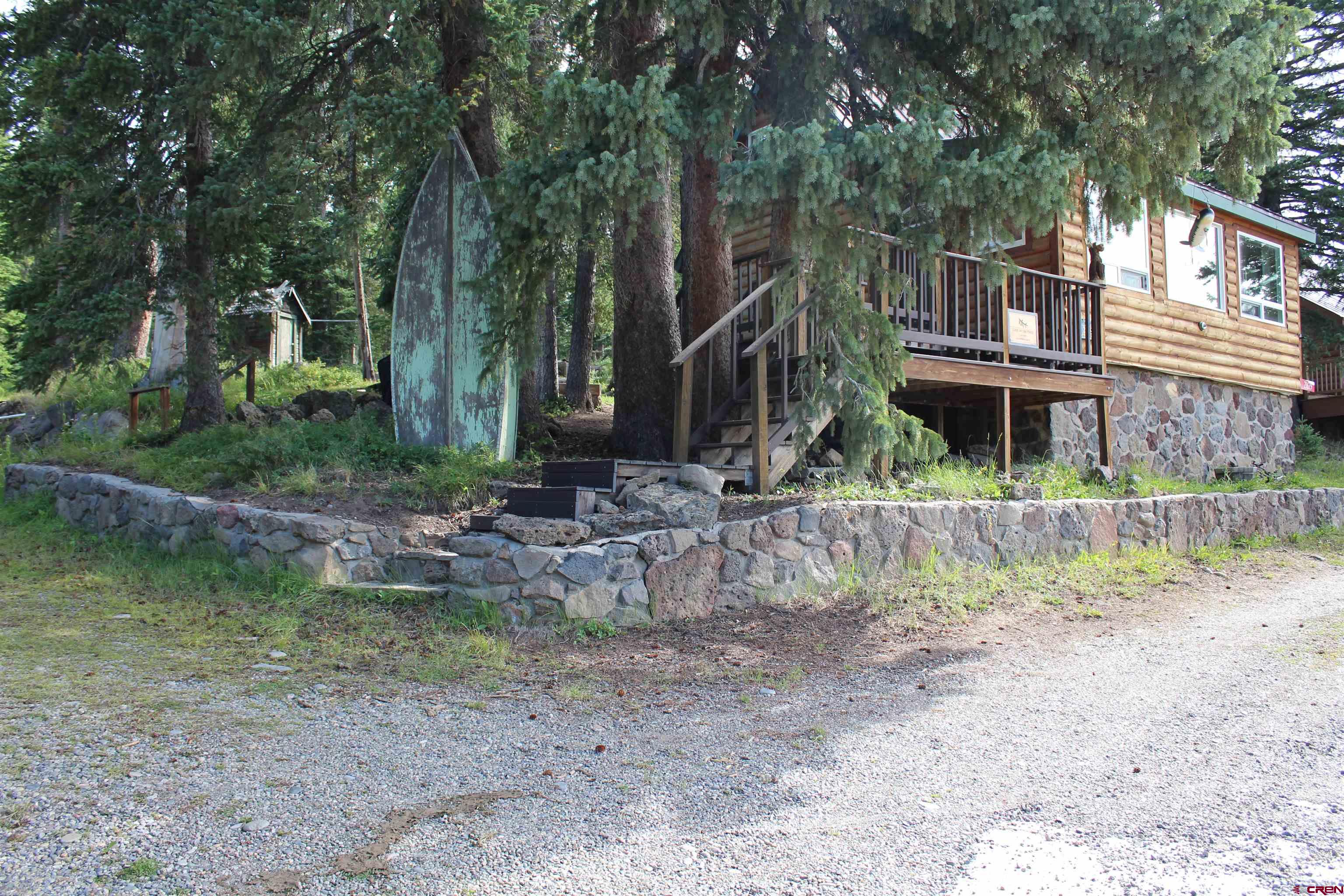 21629 Baron Lake Drive Cedaredge, CO 81413 - Photo 25 of 34 a view of house with a yard and sitting area