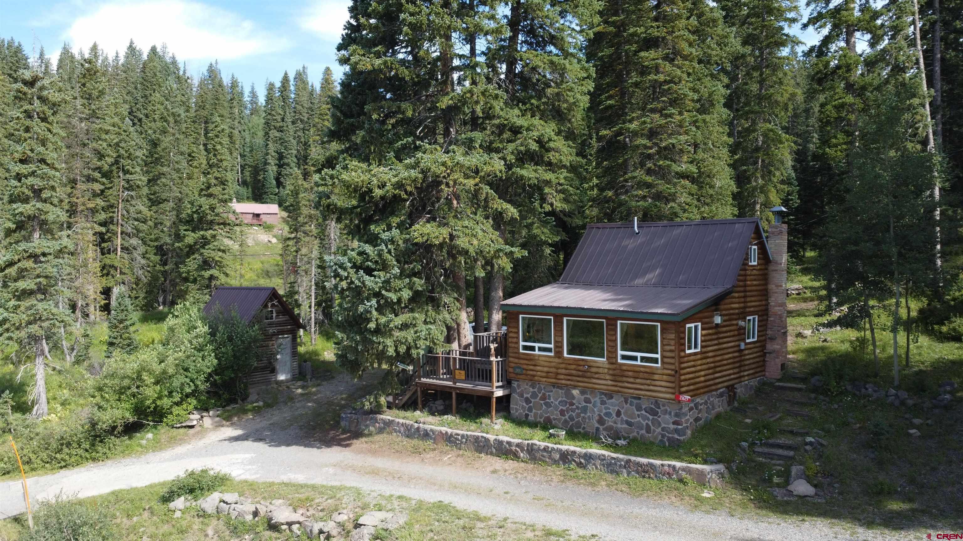 21629 Baron Lake Drive Cedaredge, CO 81413 - Photo 33 of 34 a front view of a house with a yard