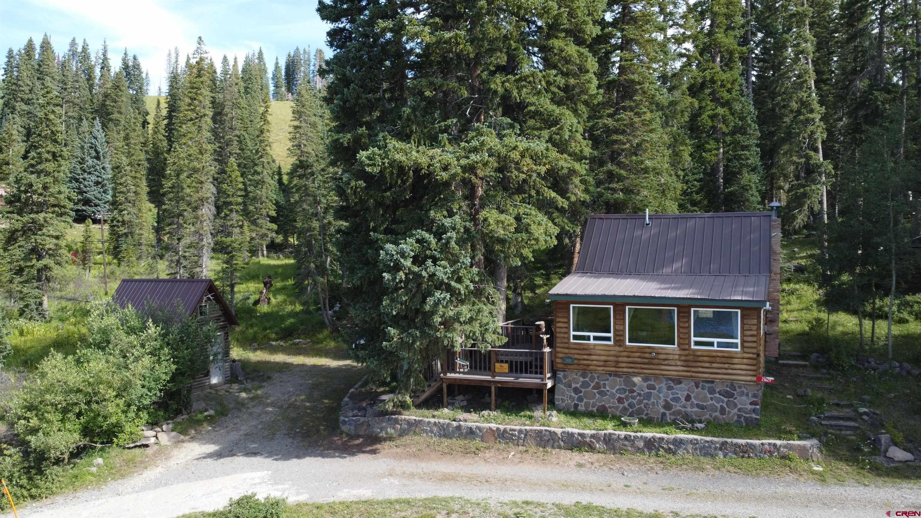 21629 Baron Lake Drive Cedaredge, CO 81413 - Photo 6 of 34 a front view of a house with garden