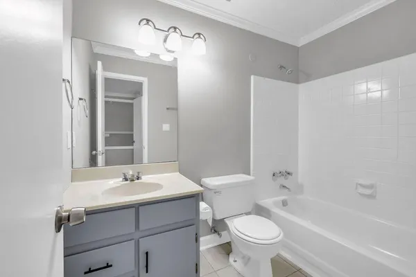 a bathroom with a sink toilet a mirror and shower