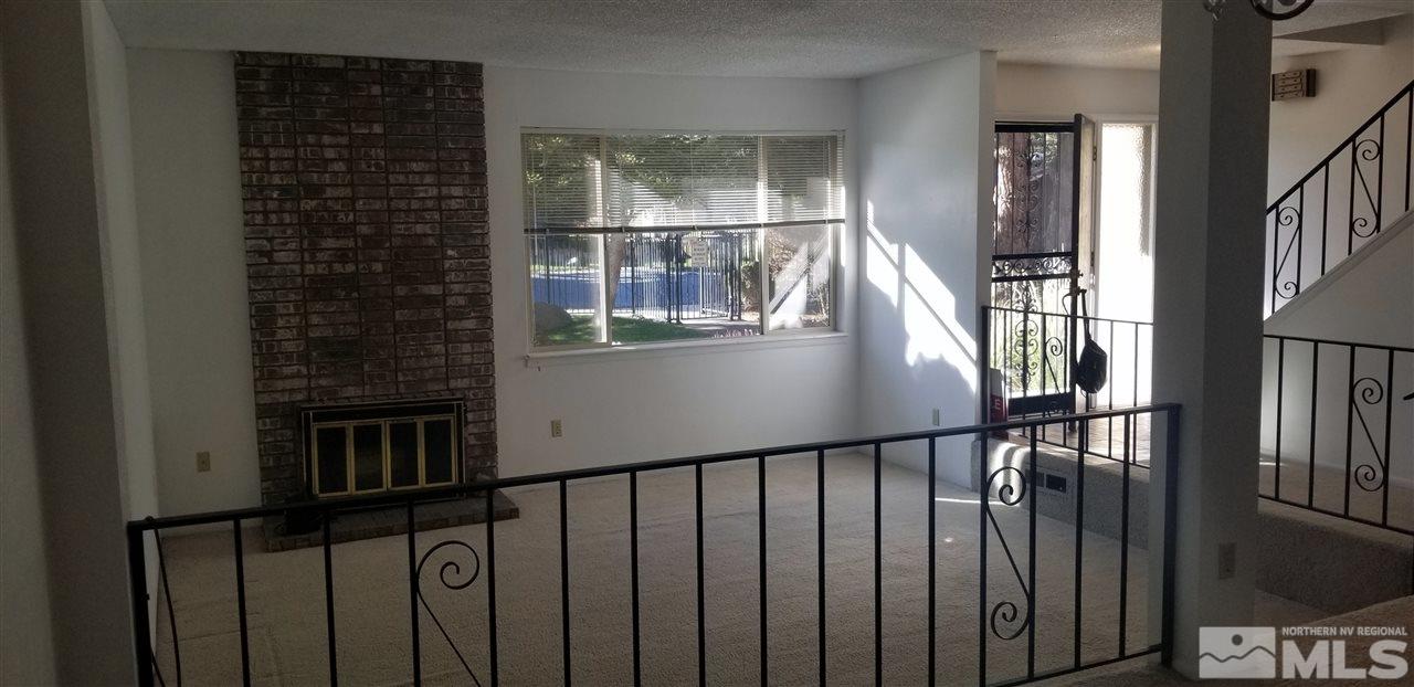 1417 Foster Drive Reno, NV 89509 - Photo 8 of 20 a view of staircase with railing and a window