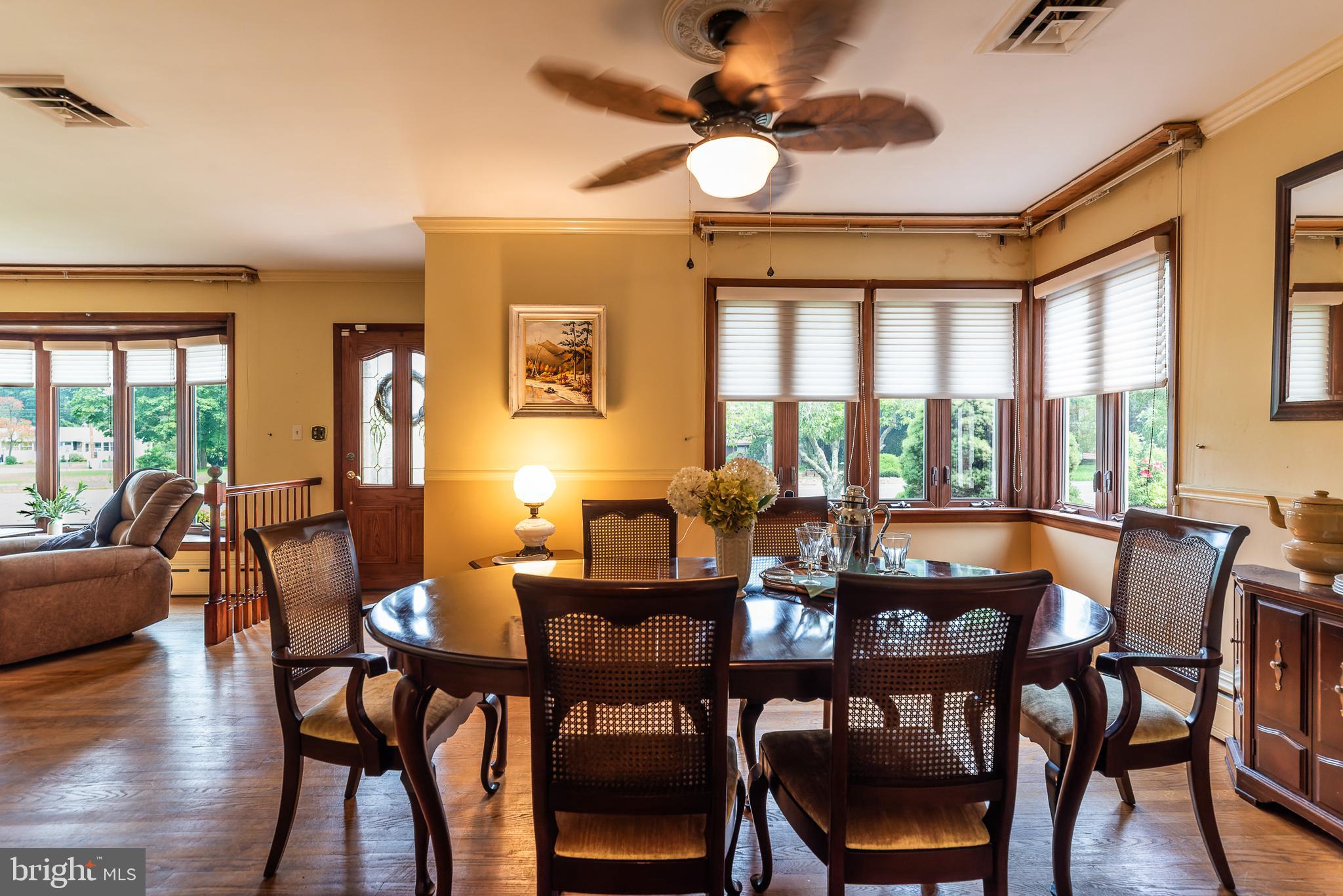 1119 Sharp Road Vineland, NJ 08360 - Photo 7 of 79 a view of a dining room with furniture wooden floor and chandelier