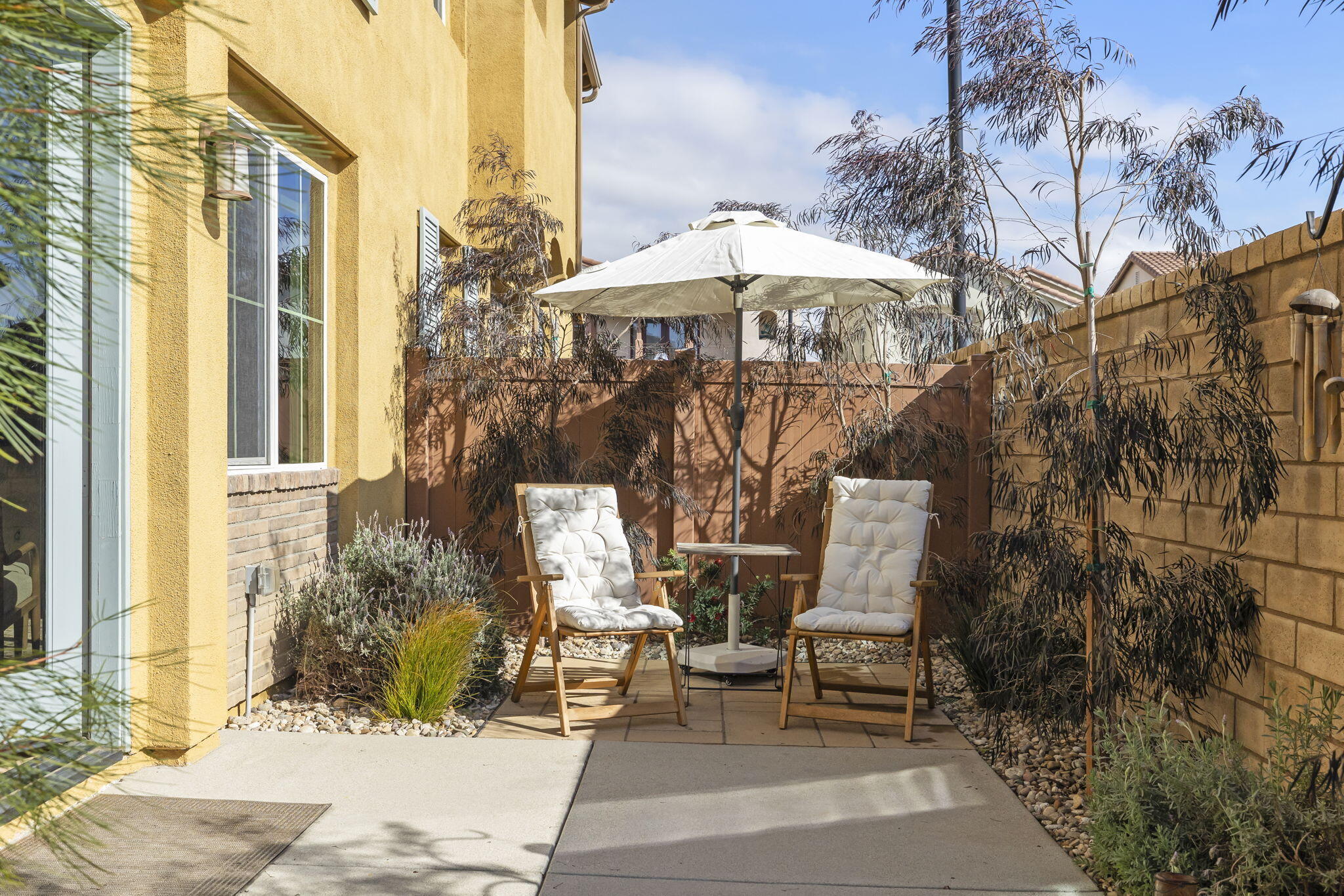 2339 Nicklaus Street Oxnard, CA 93036 - Photo 42 of 50 a front view of a building with table and chairs