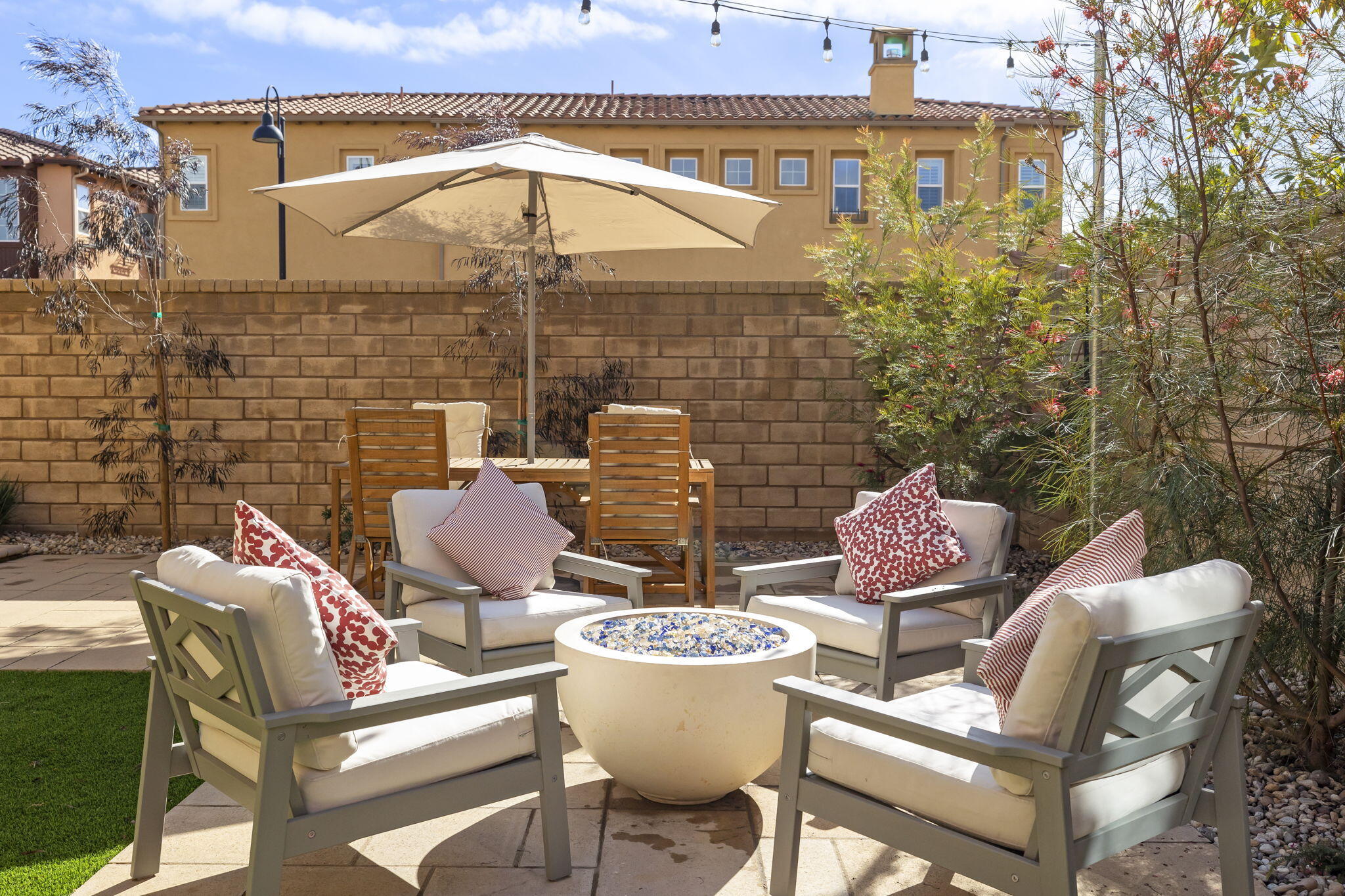 2339 Nicklaus Street Oxnard, CA 93036 - Photo 47 of 50 a view of a patio with table and chairs and potted plants