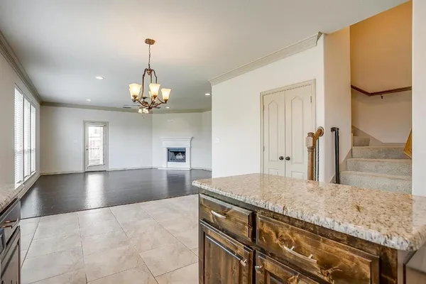 a view of a kitchen with granite countertop cabinets and a wooden floor