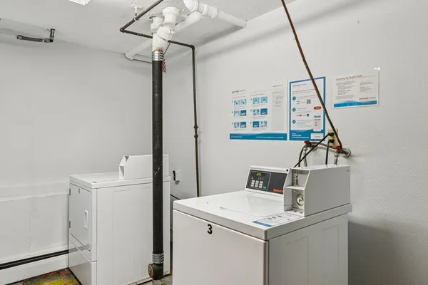 a view of storage and utility room with a sink